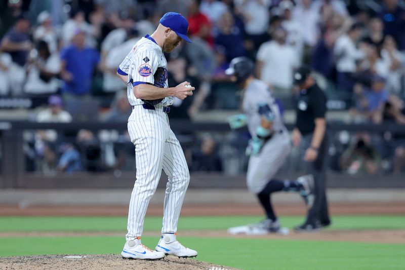 Jun 25, 2024; New York City, New York, USA; New York Mets relief pitcher Reed Garrett (75) reacts after giving up a grand slam home run to New York Yankees center fielder Aaron Judge (99) during the eighth inning at Citi Field. Mandatory Credit: Brad Penner-USA TODAY Sports