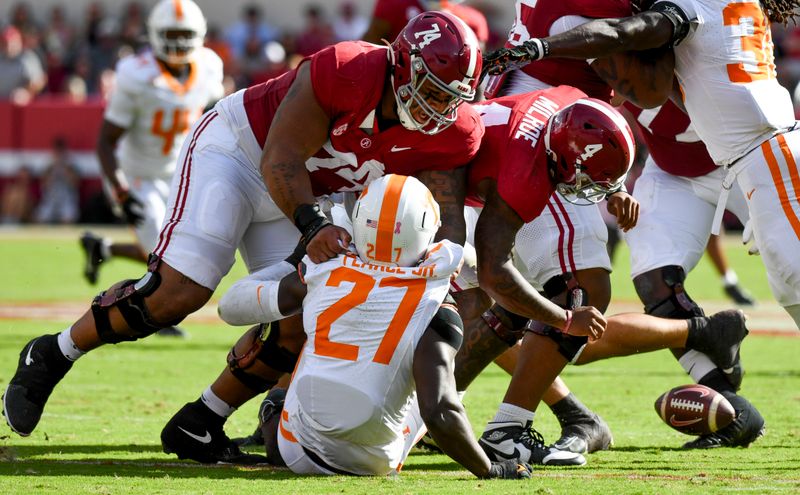 Oct 21, 2023; Tuscaloosa, Alabama, USA;  Tennessee Volunteers defensive lineman James Pearce Jr. (27) causes a fumble by Alabama Crimson Tide quarterback Jalen Milroe (4) which Tennessee recovered at Bryant-Denny Stadium. Mandatory Credit: Gary Cosby Jr.-USA TODAY Sports