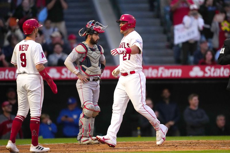 May 24, 2023; Anaheim, California, USA; Los Angeles Angels center fielder Mike Trout (27) celebrates with shortstop Zach Neto (9) after hitting a two-run home run against the Boston Red Sox in the fourth inning at Angel Stadium. Mandatory Credit: Kirby Lee-USA TODAY Sports