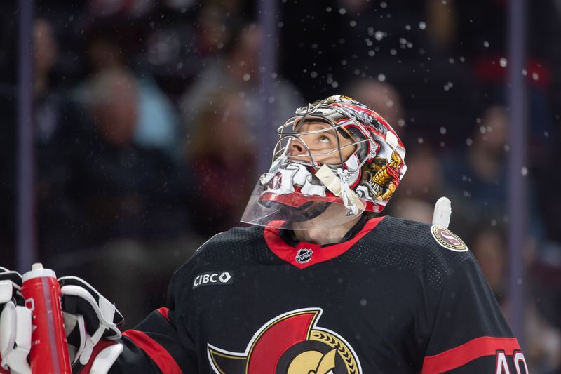 Jan 16, 2024; Ottawa, Ontario, CAN; Ottawa Senators goalie Mads Sogaard (40) spray water in the air prior to the start of the second period against the Colorado Avalanche at the Canadian Tire Centre. Mandatory Credit: Marc DesRosiers-USA TODAY Sports