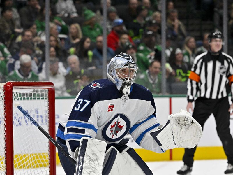 Feb 29, 2024; Dallas, Texas, USA; Winnipeg Jets goaltender Connor Hellebuyck (37) faces the Dallas Stars attack during the second period at the American Airlines Center. Mandatory Credit: Jerome Miron-USA TODAY Sports