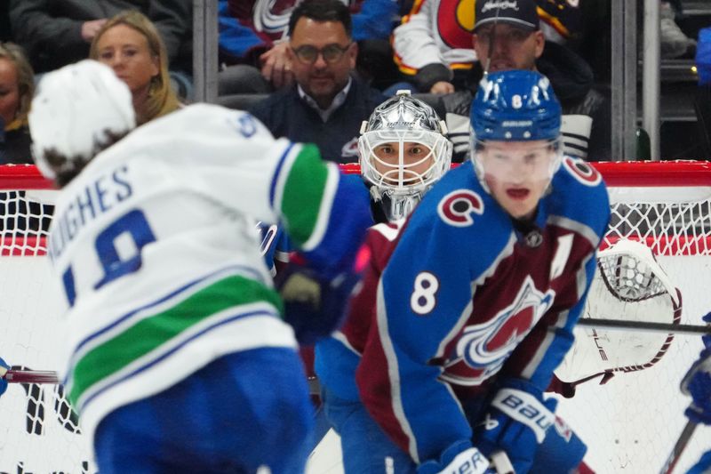 Feb 20, 2024; Denver, Colorado, USA; Colorado Avalanche goaltender Alexandar Georgiev (40) defends his net in the second period against the Vancouver Canucks at Ball Arena. Mandatory Credit: Ron Chenoy-USA TODAY Sports