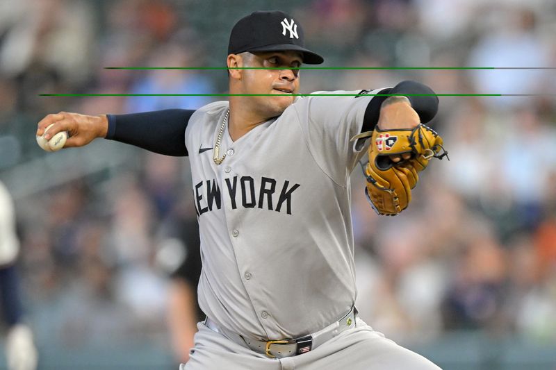 Sep 17, 2025; Minneapolis, Minnesota, USA;  New York Yankees relief pitcher Fernando Cruz (63) delivers a pitch against the Minnesota Twins during the fifth inning at Target Field. Mandatory Credit: Nick Wosika-Imagn Images

