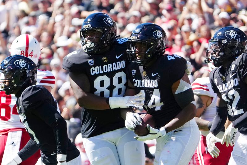 Sep 9, 2023; Boulder, Colorado, USA; Colorado Buffaloes defensive lineman Amari McNeill (88) and linebacker Jordan Domineck (44) react after a turnover against the Nebraska Cornhuskers in the second quarter at Folsom Field. Mandatory Credit: Ron Chenoy-USA TODAY Sports