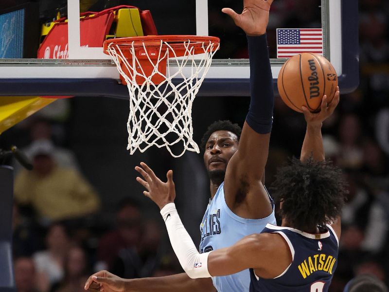 DENVER, COLORADO - MARCH 25: Peyton Watson #8 of the Denver Nuggets goes to the basket against Jaren Jackson Jr. #13 of the Memphis Grizzlies in the fourth quarter at Ball Arena on March 25, 2024 in Denver, Colorado. NOTE TO USER: User expressly acknowledges and agrees that, by downloading and or using this photograph, User is consenting to the terms and conditions of the Getty Images License Agreement. (Photo by Matthew Stockman/Getty Images)