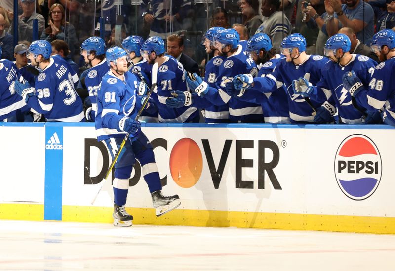 Apr 25, 2024; Tampa, Florida, USA; Tampa Bay Lightning center Steven Stamkos (91) is congratulated by center Anthony Cirelli (71) and teammates after scoring against the Florida Panthers during the second period in game three of the first round of the 2024 Stanley Cup Playoffs at Amalie Arena. Mandatory Credit: Kim Klement Neitzel-USA TODAY Sports