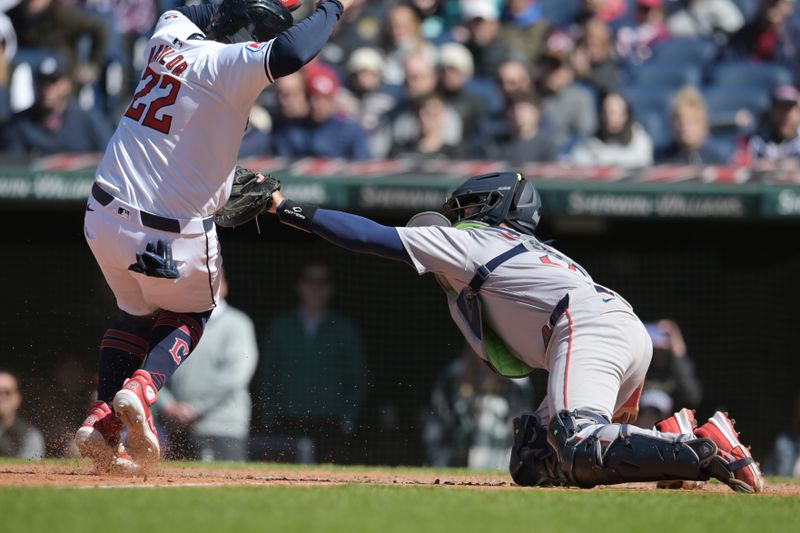 Apr 25, 2024; Cleveland, Ohio, USA; Boston Red Sox catcher Reese McGuire (3) tags out Cleveland Guardians first baseman Josh Naylor (22) during the sixth inning at Progressive Field. Mandatory Credit: Ken Blaze-USA TODAY Sports