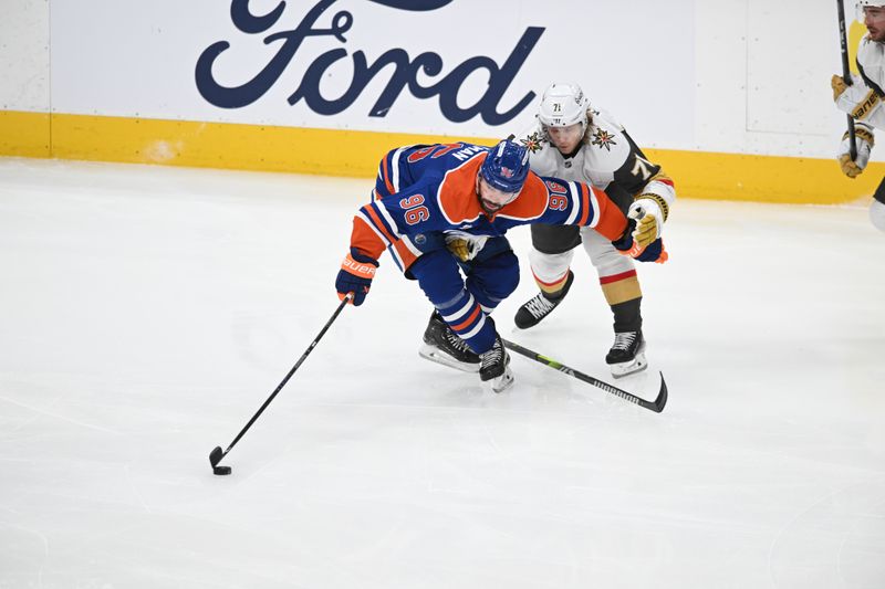 May 10, 2025; Edmonton, Alberta, CAN; Edmonton Oilers defenceman Jake Walman (96) battles with Las Vegas Golden Knights centre Willaim Karlsson (71) during the third period in game three of the second round of the 2025 Stanley Cup Playoffs at Rogers Place. Mandatory Credit: Walter Tychnowicz-Imagn Images