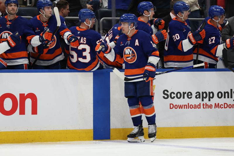 Mar 14, 2025; Elmont, New York, USA; New York Islanders center Bo Horvat (14) celebrates his goal against the Edmonton Oilers during the third period at UBS Arena. Mandatory Credit: Thomas Salus-Imagn Images