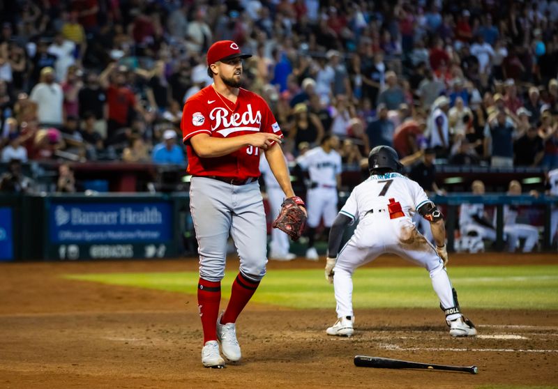 Aug 27, 2023; Phoenix, Arizona, USA; Cincinnati Reds pitcher Graham Ashcraft reacts after Arizona Diamondbacks base runner Corbin Carroll was tagged out at home in the fifth inning at Chase Field. Mandatory Credit: Mark J. Rebilas-USA TODAY Sports