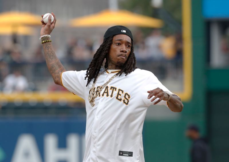 Jul 17, 2023; Pittsburgh, Pennsylvania, USA;  Recording artist and actor Wiz Khalifa throws out a ceremonial first pitch before the Pittsburgh Pirates host the Cleveland Guardians at PNC Park. Mandatory Credit: Charles LeClaire-USA TODAY Sports