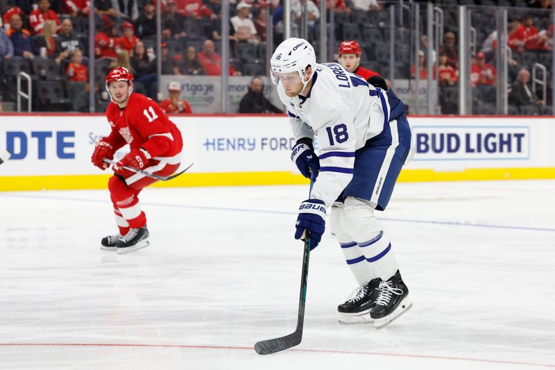 Oct 3, 2024; Detroit, Michigan, USA;  Toronto Mable Leafs center Steven Lorentz (18) skates with the puck in the third period against the Detroit Red Wings at Little Caesars Arena. Mandatory Credit: Rick Osentoski-Imagn Images