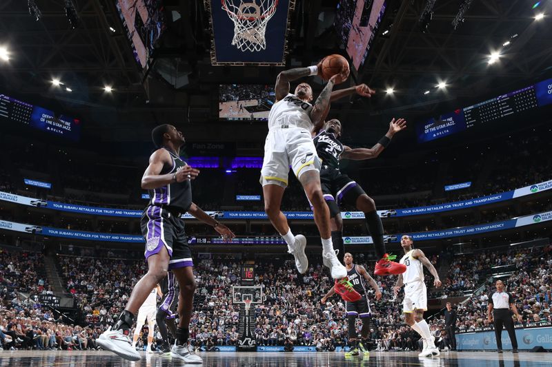 SALT LAKE CITY, UT - OCTOBER 15: John Collins #20 of the Utah Jazz drives to the basket during the game against the Sacramento Kings on October 15, 2024 at Delta Center in Salt Lake City, Utah. NOTE TO USER: User expressly acknowledges and agrees that, by downloading and or using this Photograph, User is consenting to the terms and conditions of the Getty Images License Agreement. Mandatory Copyright Notice: Copyright 2024 NBAE (Photo by Melissa Majchrzak/NBAE via Getty Images)