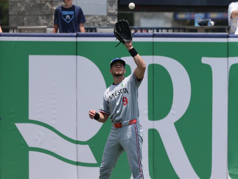 May 28, 2025; Minneapolis, Minnesota, USA;  Minnesota Twins outfielder Trevor Larnach (9) catches a fly ball during the second inning against the Tampa Bay Rays at George M. Steinbrenner Field. Mandatory Credit: Kim Klement Neitzel-Imagn Images
