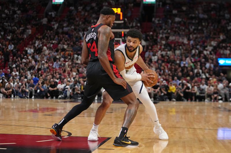 MIAMI, FL - MARCH 13: Jamal Murray #27 of the Denver Nuggets handles the ball during the game against the Miami Heat on March 13, 2024 at Kaseya Center in Miami, Florida. NOTE TO USER: User expressly acknowledges and agrees that, by downloading and or using this Photograph, user is consenting to the terms and conditions of the Getty Images License Agreement. Mandatory Copyright Notice: Copyright 2024 NBAE (Photo by Eric Espada/NBAE via Getty Images)