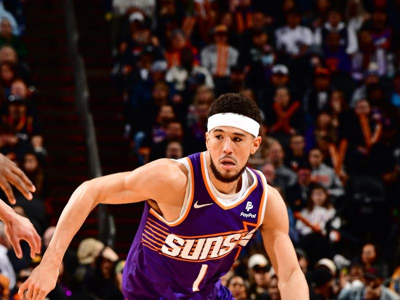 PHOENIX, AZ - JANUARY 7: Devin Booker #1 of the Phoenix Suns dribbles the ball during the game against the Memphis Grizzlies on January 7, 2024 at Footprint Center in Phoenix, Arizona. NOTE TO USER: User expressly acknowledges and agrees that, by downloading and or using this photograph, user is consenting to the terms and conditions of the Getty Images License Agreement. Mandatory Copyright Notice: Copyright 2024 NBAE (Photo by Barry Gossage/NBAE via Getty Images)