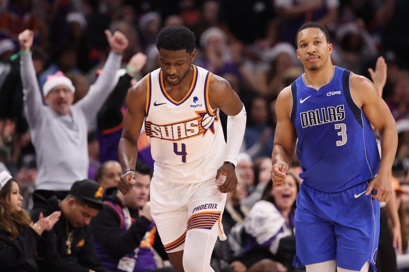 PHOENIX, ARIZONA - DECEMBER 25: Chimezie Metu #4 of the Phoenix Suns reacts after hitting a three-point shot over Grant Williams #3 of the Dallas Mavericks during the first half of the NBA game at Footprint Center on December 25, 2023 in Phoenix, Arizona. NOTE TO USER: User expressly acknowledges and agrees that, by downloading and or using this photograph, User is consenting to the terms and conditions of the Getty Images License Agreement.  (Photo by Christian Petersen/Getty Images)