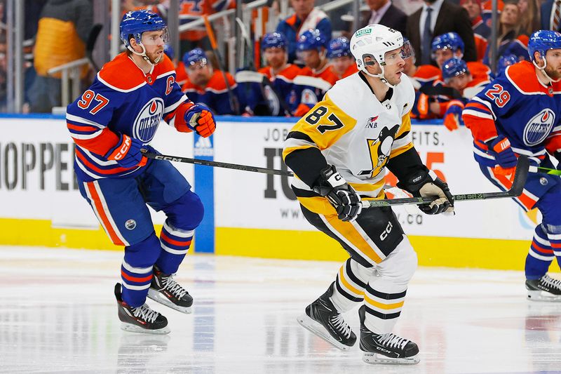 Mar 3, 2024; Edmonton, Alberta, CAN; Pittsburgh Penguins forward Sidney Crosby (87) and Edmonton Oilers forward Connor McDavid (97) follow the play during the third period at Rogers Place. Mandatory Credit: Perry Nelson-USA TODAY Sports