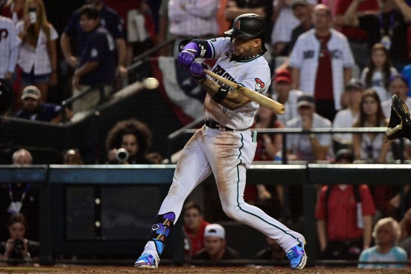 Oct 19, 2023; Phoenix, Arizona, USA; Arizona Diamondbacks second baseman Ketel Marte (4) hits the game winning single to score a run against the Philadelphia Phillies in the ninth inning during game three of the NLCS for the 2023 MLB playoffs at Chase Field. Mandatory Credit: Matt Kartozian-USA TODAY Sports