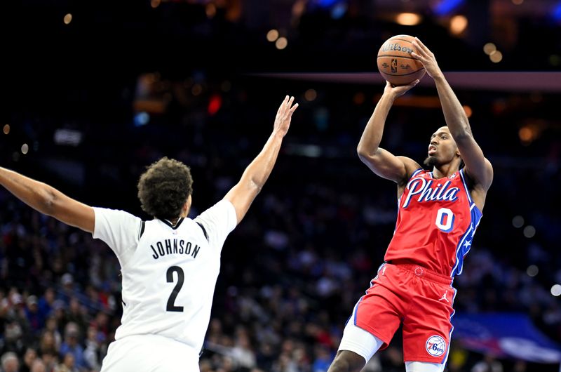 PHILADELPHIA, PENNSYLVANIA - NOVEMBER 22: Tyrese Maxey #0 of the Philadelphia 76ers shoots the ball over Cameron Johnson #2 of the Brooklyn Nets in the first quarter of the Emirates NBA Cup game at the Wells Fargo Center on November 22, 2024 in Philadelphia, Pennsylvania. NOTE TO USER: User expressly acknowledges and agrees that, by downloading and or using this photograph, User is consenting to the terms and conditions of the Getty Images License Agreement. (Photo by G Fiume/Getty Images)