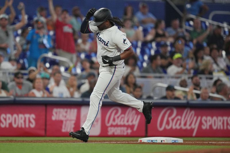 Jul 25, 2024; Miami, Florida, USA;  Miami Marlins designated hitter Josh Bell (9) rounds the bases after hitting a home run against the Baltimore Orioles in the sixth inning at loanDepot Park. Mandatory Credit: Jim Rassol-USA TODAY Sports