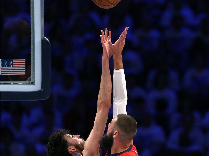 OKLAHOMA CITY, OKLAHOMA - APRIL 24:  Jonas Valanciunas #17 of the New Orleans Pelicans shoots over Chet Holmgren #7 of the Oklahoma City Thunder during game two of the first round of the NBA playoffs at Paycom Center on April 24, 2024 in Oklahoma City, Oklahoma. (Photo by Jamie Squire/Getty Images)