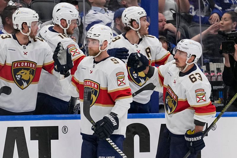 May 14, 2025; Toronto, Ontario, CAN; Florida Panthers forward Sam Bennett (9) gets congratulated after a goal against the Toronto Maple Leafs during the third period of game five of the second round of the 2025 Stanley Cup Playoffs at Scotiabank Arena. Mandatory Credit: John E. Sokolowski-Imagn Images