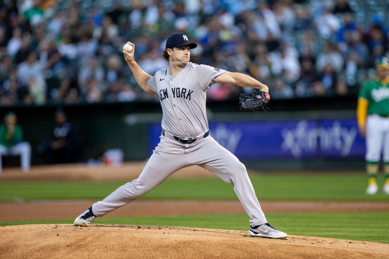 Sep 20, 2024; Oakland, California, USA; New York Yankees pitcher Gerrit Cole (45) throws a pitch during the first inning against the Oakland Athletics at Oakland-Alameda County Coliseum. Mandatory Credit: Bob Kupbens-Imagn Images