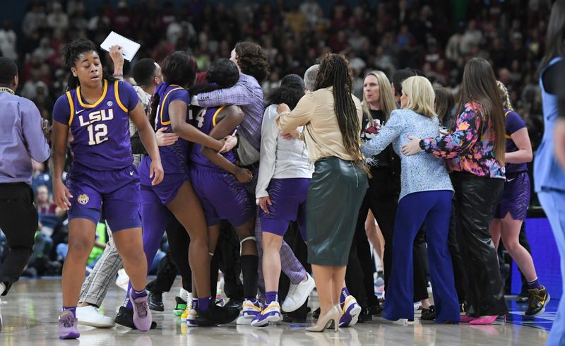 Mar 10, 2024; Greensville, SC, USA; LSU and USC players scuffle during the fourth quarter of the SEC Women's Basketball Tournament Championship game at the Bon Secours Wellness Arena. Mandatory Credit: Ken Ruinard-USA TODAY Sports via Greenville News
 