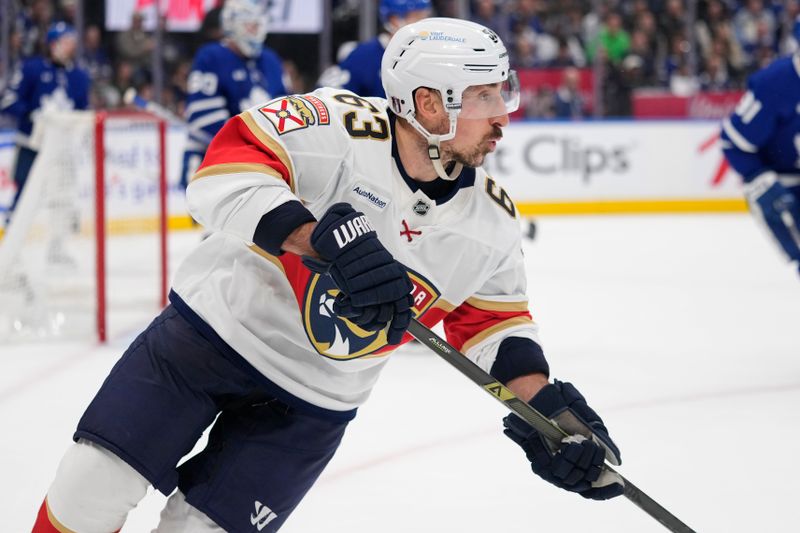 May 18, 2025; Toronto, Ontario, CAN; Florida Panthers forward Brad Marchand (63) skates against the Toronto Maple Leafs during the second period of game seven of the second round of the 2025 Stanley Cup Playoffs at Scotiabank Arena. Mandatory Credit: John E. Sokolowski-Imagn Images