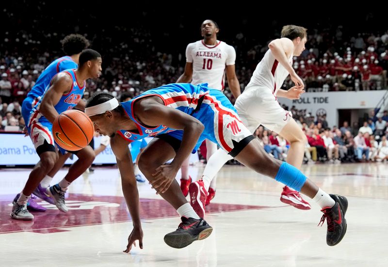 Jan 14, 2025; Tuscaloosa, AL, USA; Ole Miss guard Davon Barnes (7) comes up with a steal at Coleman Coliseum. Ole Miss defeated Alabama 74-64. Mandatory Credit: Gary Cosby Jr./USA TODAY Network via Imagn Images