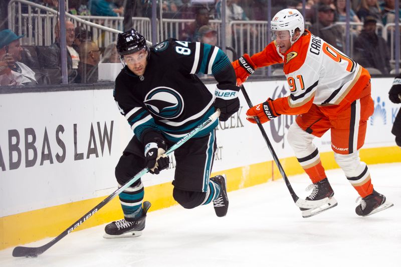 Oct 12, 2024; San Jose, California, USA; San Jose Sharks defenseman Jan Rutta (84) is pursued by Anaheim Ducks center Leo Carlsson (91) during the second period at SAP Center at San Jose. Mandatory Credit: D. Ross Cameron-Imagn Images