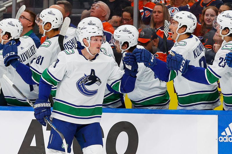 Oct 14, 2023; Edmonton, Alberta, CAN; The Vancouver Canucks celebrate a goal by forward Sam Lafferty (18) during the second period against the Edmonton Oilers at Rogers Place. Mandatory Credit: Perry Nelson-USA TODAY Sports