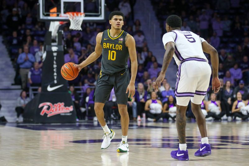 Jan 16, 2024; Manhattan, Kansas, USA; Baylor Bears guard RayJ Dennis (10) brings the ball up court against Kansas State Wildcats guard Cam Carter (5) during the second half at Bramlage Coliseum. Mandatory Credit: Scott Sewell-USA TODAY Sports