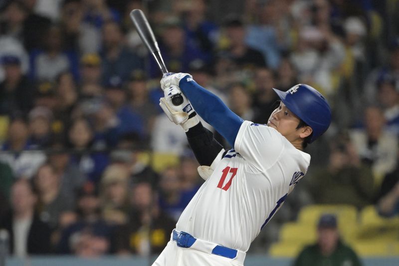 Sep 26, 2024; Los Angeles, California, USA;  Los Angeles Dodgers designated hitter Shohei Ohtani (17) flies out in the first inning against the San Diego Padres at Dodger Stadium. Mandatory Credit: Jayne Kamin-Oncea-Imagn Images