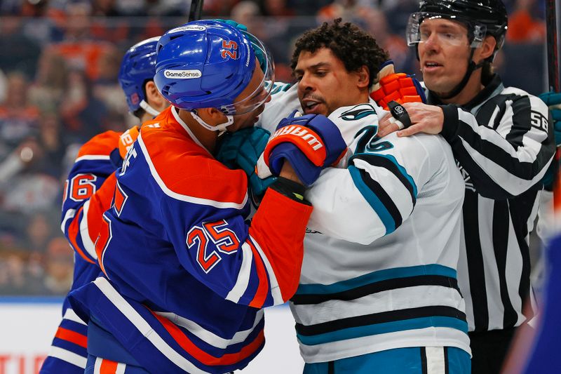 Jan 29, 2026; Edmonton, Alberta, CAN;  Edmonton Oilers defensemen Darnell Nurse (25) and San Jose Sharks forward Ryan Reeves (75) wrestle during the first period at Rogers Place. Mandatory Credit: Perry Nelson-Imagn Images