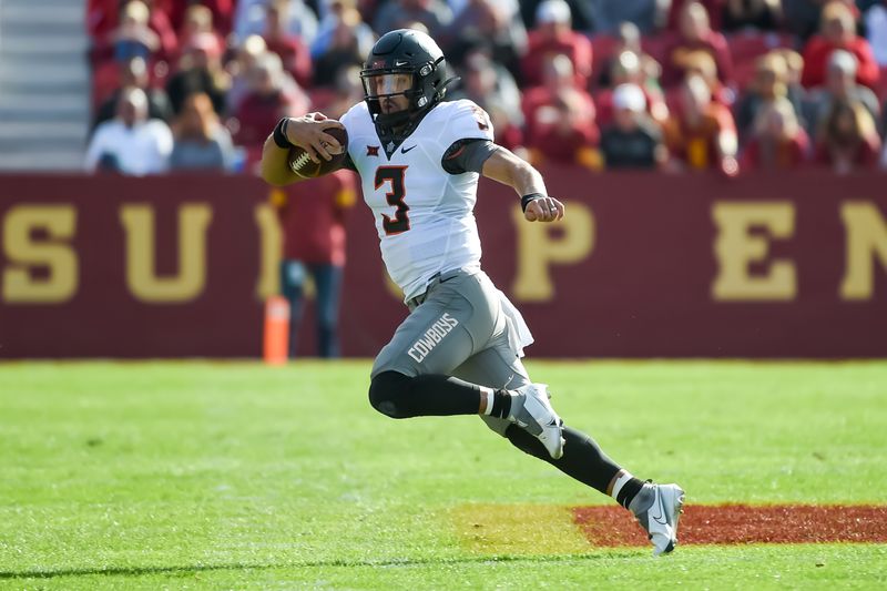 Oct 23, 2021; Ames, Iowa, USA;  Oklahoma State Cowboys quarterback Spencer Sanders (3) runs against the Iowa State Cyclones in the first half at Jack Trice Stadium. Mandatory Credit: Steven Branscombe-USA TODAY Sports