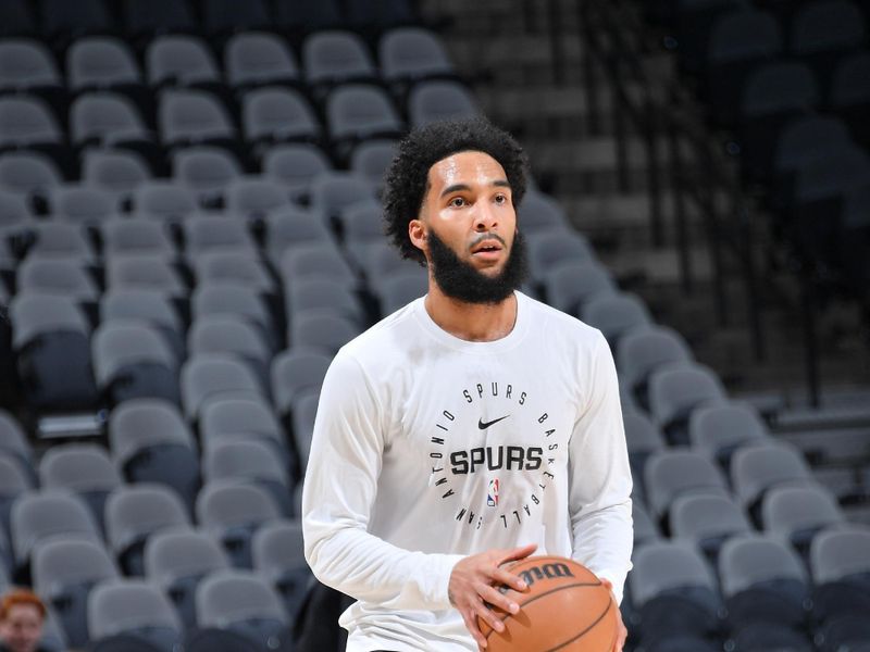 SAN ANTONIO, TX - MARCH 14:  Julian Champagnie #30 of the San Antonio Spurs warms up before the game Charlotte Hornets  on March 14, 2025 at the Frost Bank Center in San Antonio, Texas. NOTE TO USER: User expressly acknowledges and agrees that, by downloading and or using this photograph, user is consenting to the terms and conditions of the Getty Images License Agreement. Mandatory Copyright Notice: Copyright 2025 NBAE (Photos by Michael Gonzales/NBAE via Getty Images)