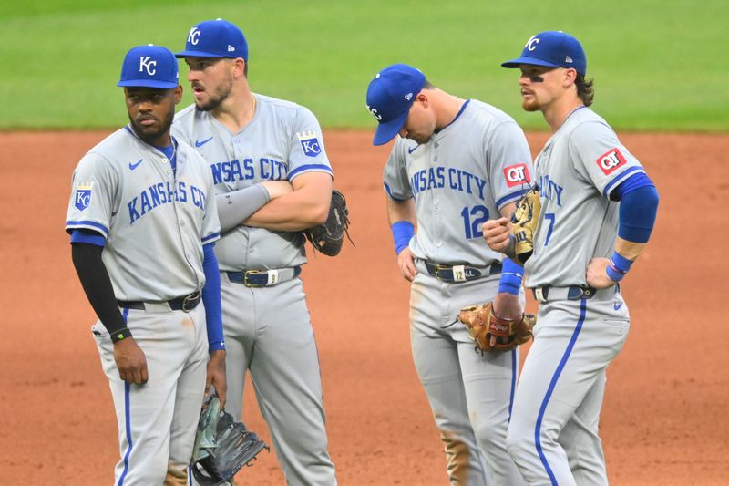 Jun 4, 2024; Cleveland, Ohio, USA; Kansas City Royals infielders stand on the field during a pitching change in the seventh inning against the Cleveland Guardians at Progressive Field. Mandatory Credit: David Richard-USA TODAY Sports