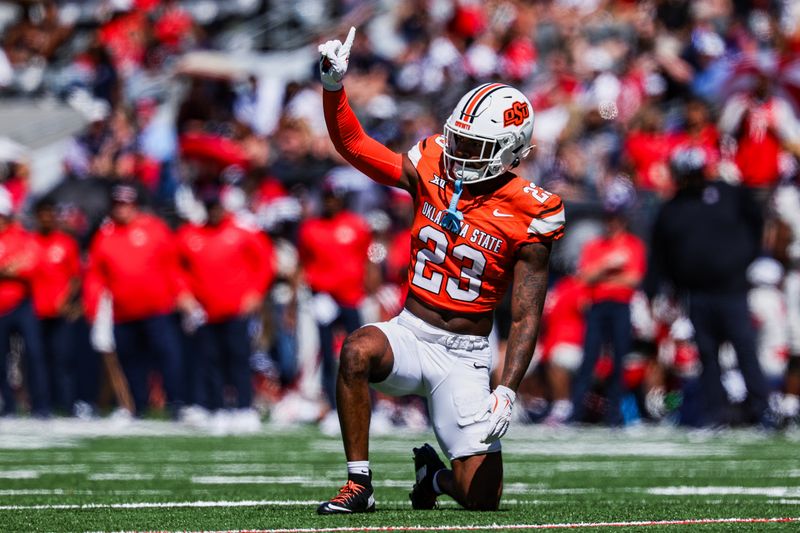 Oct 4, 2025; Tucson, Arizona, USA; Oklahoma State Cowboys safety Kenneth Harris (23) acknowledges the crowd against the Arizona Wildcats during the second quarter at Arizona Stadium. Mandatory Credit: Aryanna Frank-Imagn Images