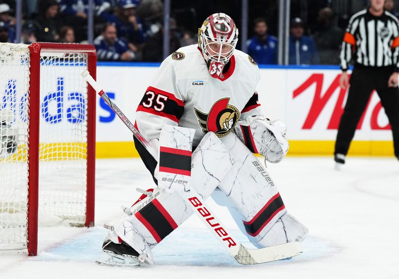 Nov 12, 2024; Toronto, Ontario, CAN; Ottawa Senators goaltender Linus Ullmark (35) follows the play against the Toronto Maple Leafs during the third period at Scotiabank Arena. Mandatory Credit: Nick Turchiaro-Imagn Images