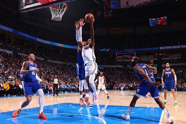 OKLAHOMA CITY, OK - DECEMBER 21: Shai Gilgeous-Alexander #2 of the Oklahoma City Thunder drives to the basket during the game against the LA Clippers on December 21, 2023 at Paycom Arena in Oklahoma City, Oklahoma. NOTE TO USER: User expressly acknowledges and agrees that, by downloading and or using this photograph, User is consenting to the terms and conditions of the Getty Images License Agreement. Mandatory Copyright Notice: Copyright 2023 NBAE (Photo by Zach Beeker/NBAE via Getty Images)