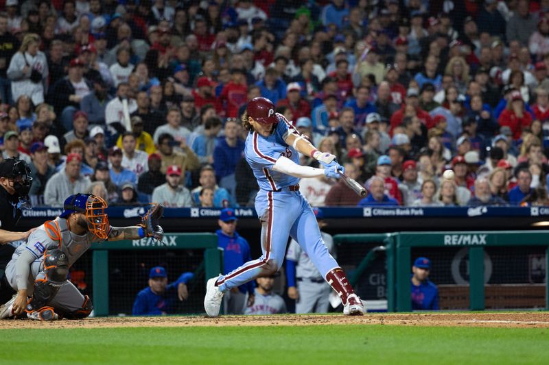 May 16, 2024; Philadelphia, Pennsylvania, USA; Philadelphia Phillies third base Alec Bohm (28) hits an RBI single during the sixth inning against the New York Mets at Citizens Bank Park. Mandatory Credit: Bill Streicher-USA TODAY Sports