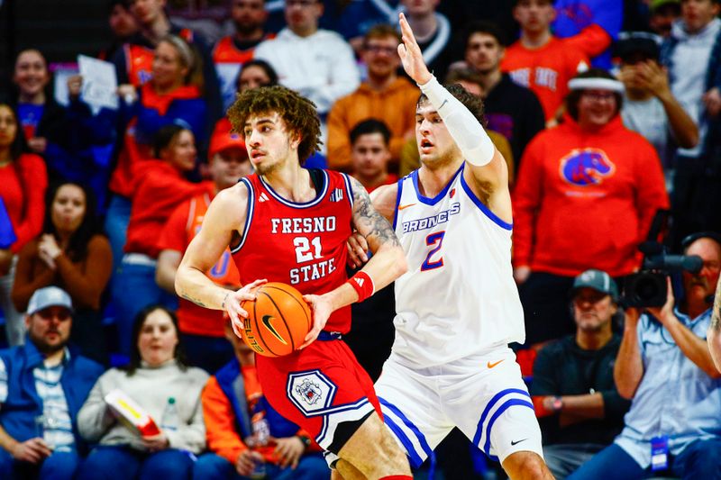 Feb 1, 2024; Boise, Idaho, USA; Boise State Broncos forward Tyson Degenhart (2) guards Fresno State Bulldogs guard Isaiah Pope (21) during the second half at ExtraMile Arena. Boise State defeats Fresno State 90-66. Mandatory Credit: Brian Losness-USA TODAY Sports
