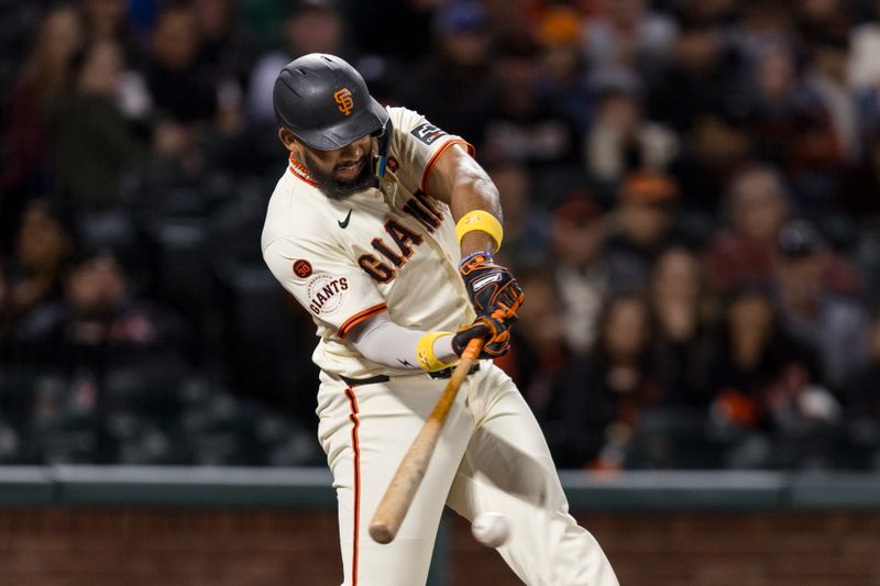 Sep 11, 2024; San Francisco, California, USA; San Francisco Giants designated hitter Jerar Encarnacion (59) hits an RBI single against the Milwaukee Brewers during the sixth inning at Oracle Park. Mandatory Credit: John Hefti-Imagn Images