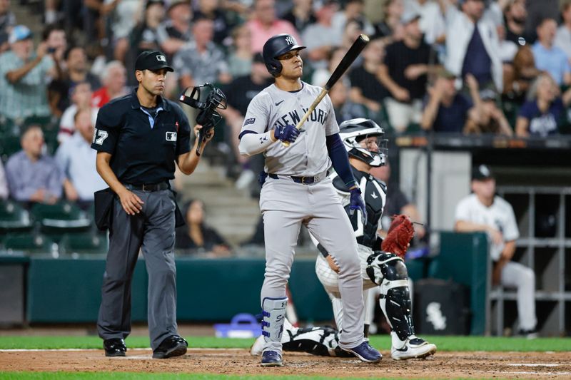 Aug 13, 2024; Chicago, Illinois, USA; New York Yankees outfielder Juan Soto (22) hits a solo home run against the Chicago White Sox during the seventh inning at Guaranteed Rate Field. Mandatory Credit: Kamil Krzaczynski-USA TODAY Sports