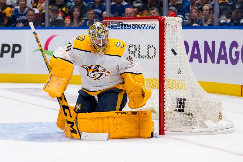 Apr 23, 2024; Vancouver, British Columbia, CAN; Nashville Predators goalie Juuse Saros (74) makes a save against the Vancouver Canucks during the first period in game two of the first round of the 2024 Stanley Cup Playoffs at Rogers Arena. Mandatory Credit: Bob Frid-USA TODAY Sports