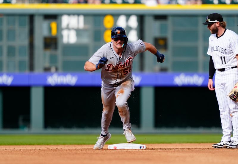 May 8, 2025; Denver, Colorado, USA; Detroit Tigers center fielder Brewer Hicklen (50) advances to third after a throwing error by the Colorado Rockies in the fourth inning at Coors Field. Mandatory Credit: Ron Chenoy-Imagn Images