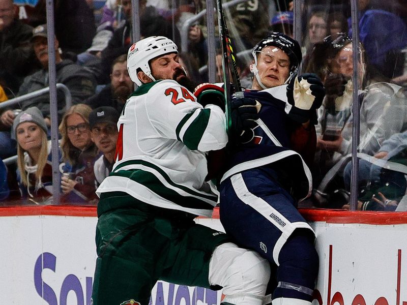 Mar 8, 2024; Denver, Colorado, USA; Minnesota Wild defenseman Zach Bogosian (24) checks Colorado Avalanche left wing Artturi Lehkonen (62) into the boards in the second period at Ball Arena. Mandatory Credit: Isaiah J. Downing-USA TODAY Sports