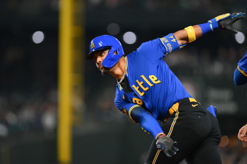 Sep 14, 2024; Seattle, Washington, USA; Seattle Mariners center fielder Julio Rodriguez (44) celebrates after hitting a single against the Texas Rangers during the first inning at T-Mobile Park. Mandatory Credit: Steven Bisig-Imagn Images